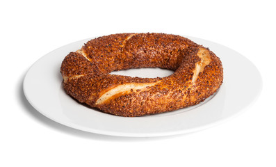 Simit (Turkish bagel) on white plate