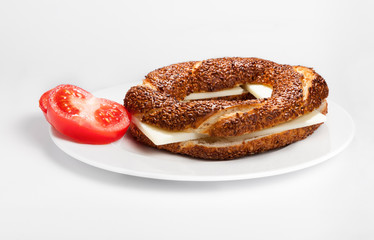Simit (Turkish bagel) on white plate