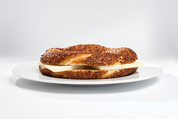 Simit (Turkish bagel) on white plate