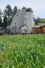 a barn with wheel fence