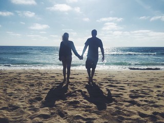 happy couple on the beach in california