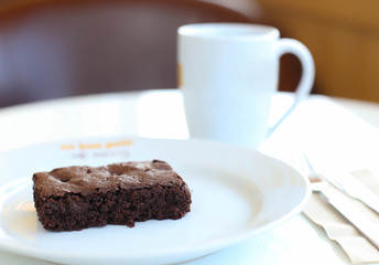 Chocolate brownie with coffee, selective focus