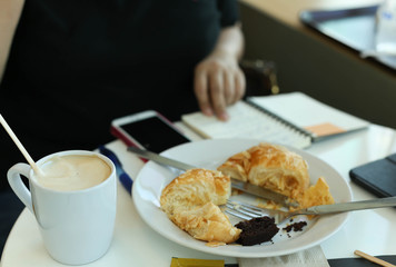 Business people working at lunch time