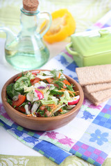 Fototapeta na wymiar Vegetable salad in a wooden bowl