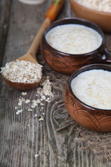 Oatmeal on old wooden table