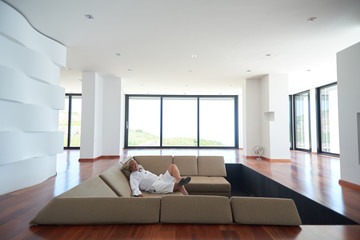 Portrait of senior man relaxing in sofa