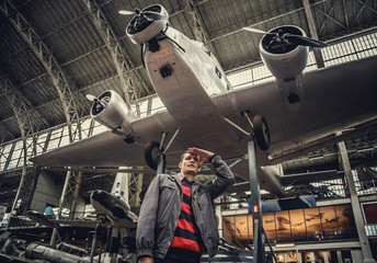 Naklejka premium Man on airplanes exhibition.