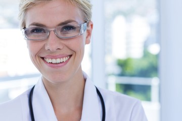 Fototapeta premium Close up view of happy female doctor looking at camera