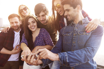 Group of friends taking some photos.