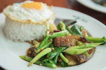 Kale with crispy pork and rice, food