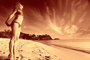 beautiful girl runs along the beach in a bikini tan summer vacation