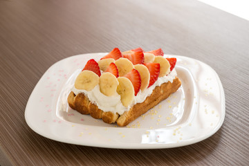 Belgian waffle with banana and strawberry