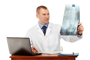 Portrait of a young male doctor in a white coat