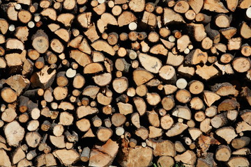 Pile of chopped fire wood and crowded