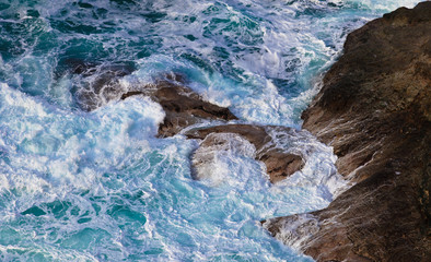 Obraz premium Swirling Waters on a Rugged Coast