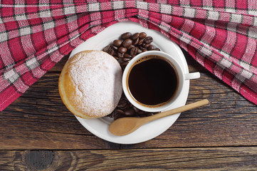 Plate with coffee and donut