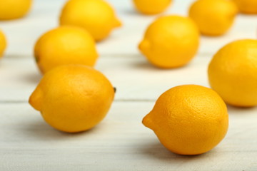 Fresh lemons on a wooden background