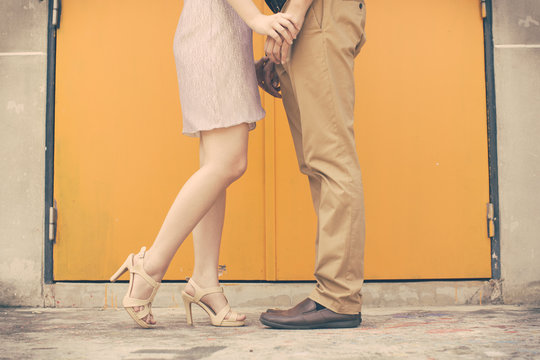 Vintage tone of Male and female legs during a date