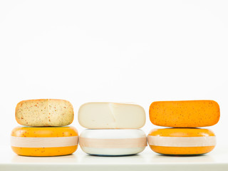 three kinds of cheese arranged in line