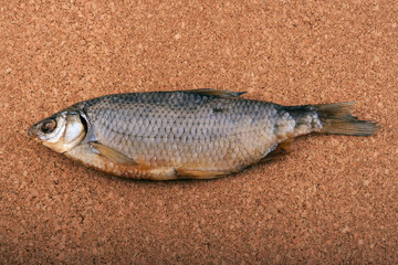 Dried fish on a cork
