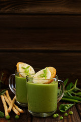 Green pea soup with croutons and cheese.