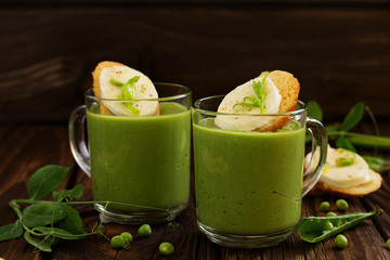 Green pea soup with croutons and cheese.