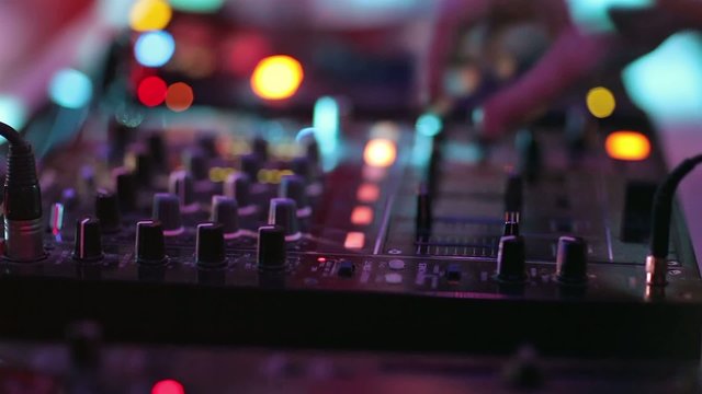 Close-up video of Dj mixing at the night club.