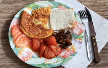 Omelet breakfast snack with cheese and tomatoes