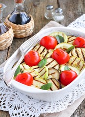 Grilled vegetables eggplant, cherry tomatoe, zucchini with olive oil and basil