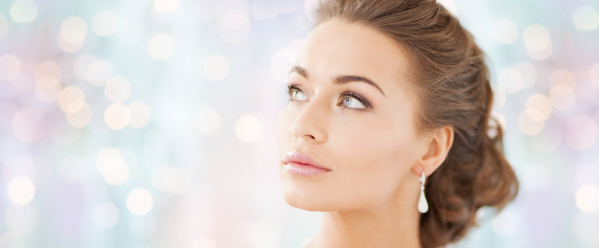 woman with diamond earrings