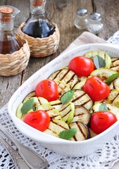 Grilled vegetables eggplant, cherry tomatoe, zucchini with olive oil and basil