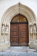 Fototapeta na wymiar An old entrance of church with wooden door