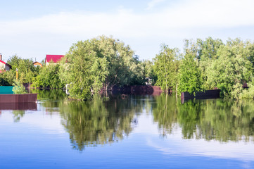 Fototapeta premium Flooded houses and trees