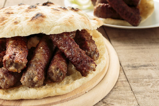 Cevapi (Cevapcici), Bosnian dish prepared on the barbecue and served with Lepinja bread. This dish is popular all over the Balkans, with tourists and locals.