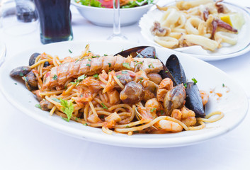 Seafood pasta in restaurant at Venice, Italy.