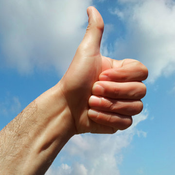 like hand over cloudy sky