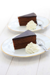 homemade , Austrian chocolate cake isolated on white wooden background