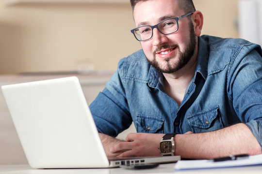 Portrait young businessman in his office