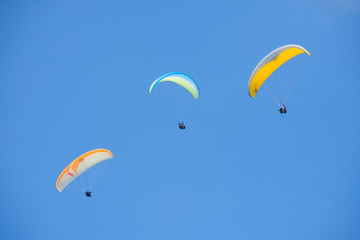 Paragliding in blue sky