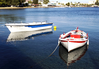 two fishing boats with water reflections