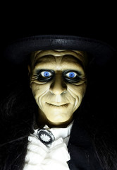Scary Halloween Igor the zombie butler dummy with black background
