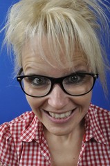 Portrait of a blonde woman wearing glasses