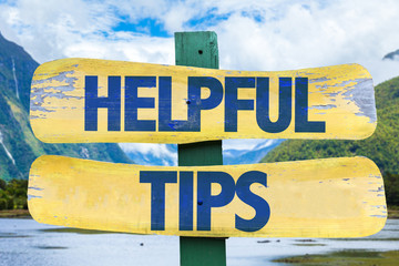 Helpful Tips sign with mountains background
