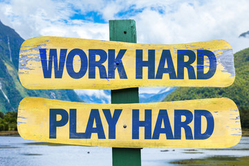 Fototapeta premium Work Hard Play Hard sign with mountains background