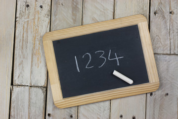Small blackboard with white chalk