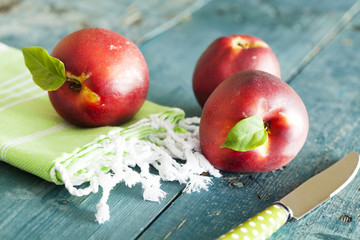 Group of fresh peaches on vintage wooden