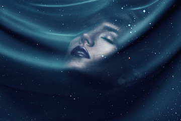 Obraz na płótnie Canvas woman under transparent textile with stars