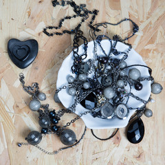 Pile of assorted black chains with shiny box chains,