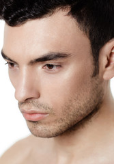 Obraz premium Charming and handsome man face over a white background