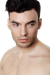 Obraz premium Charming and handsome man face over a white background